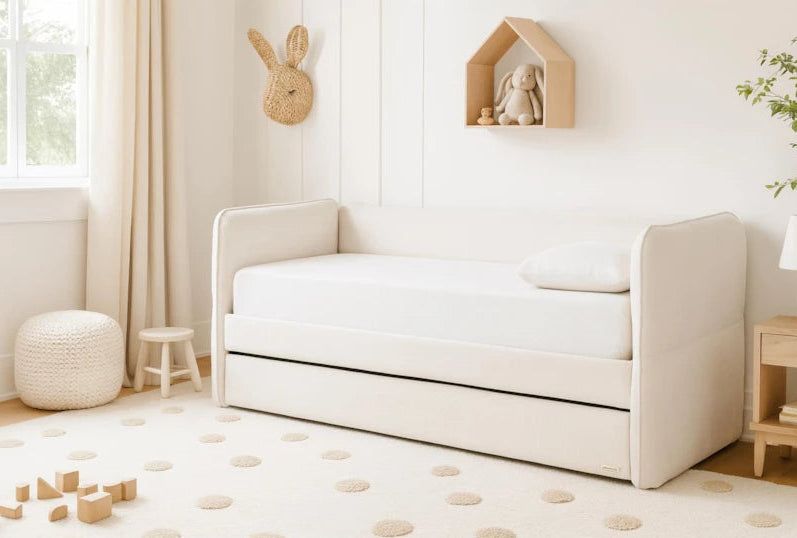 Children's room with a white crib, toys, and decorative elements.