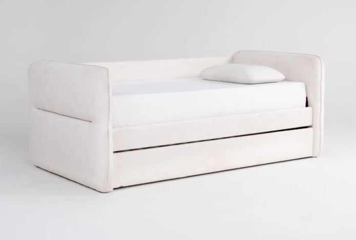 White upholstered bed with storage drawers on a white background