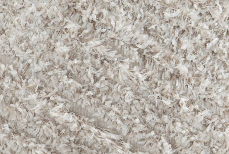 Close-up of a textured beige fabric surface