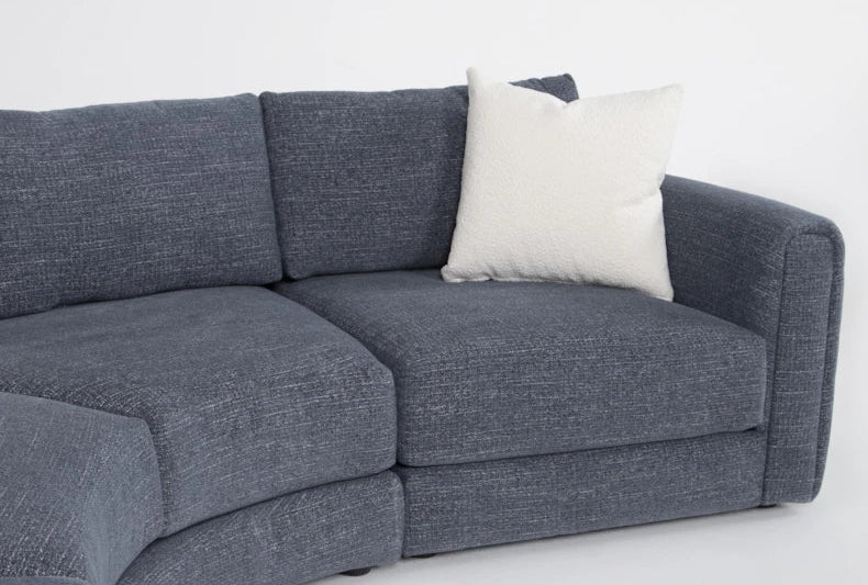 Sectional sofa with a white pillow on a white background
