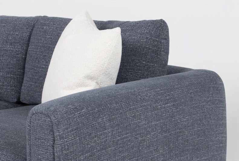 Sofa with a white pillow on a light gray background