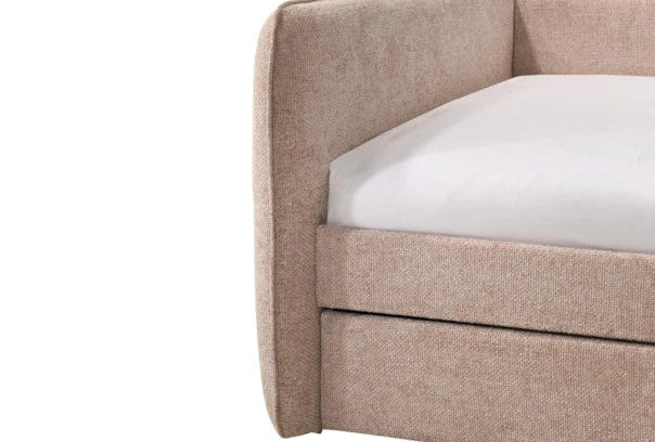 Beige upholstered bed frame with white mattress on a white background