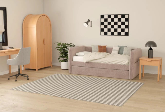 Modern bedroom with a bed, desk, wardrobe, and decor items.