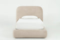 Beige bed with white bedding on a white background