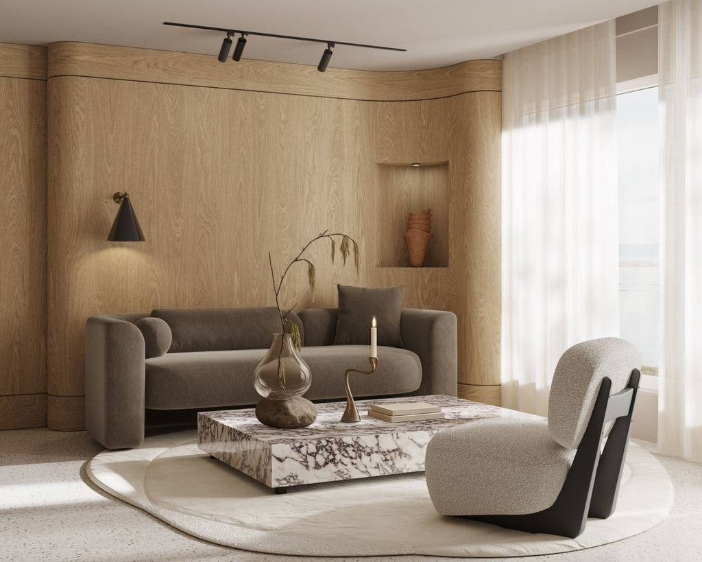 Modern living room with a gray sofa, coffee table, and decorative items.