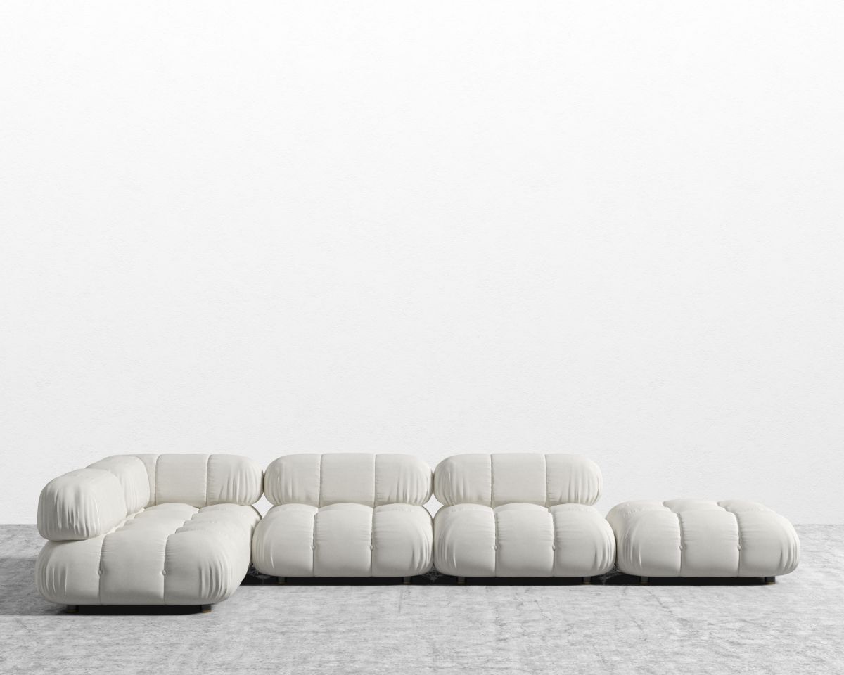 Modern white sofa on a textured floor with a light gray background