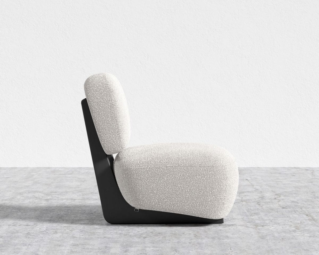 Modern chair with a white cushion on a gray floor and light gray background