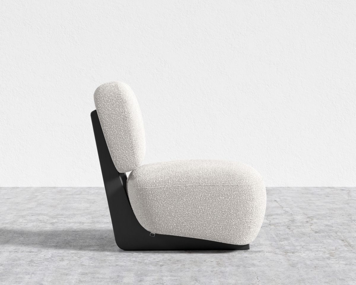 Modern chair with a white cushion on a gray floor and light gray background