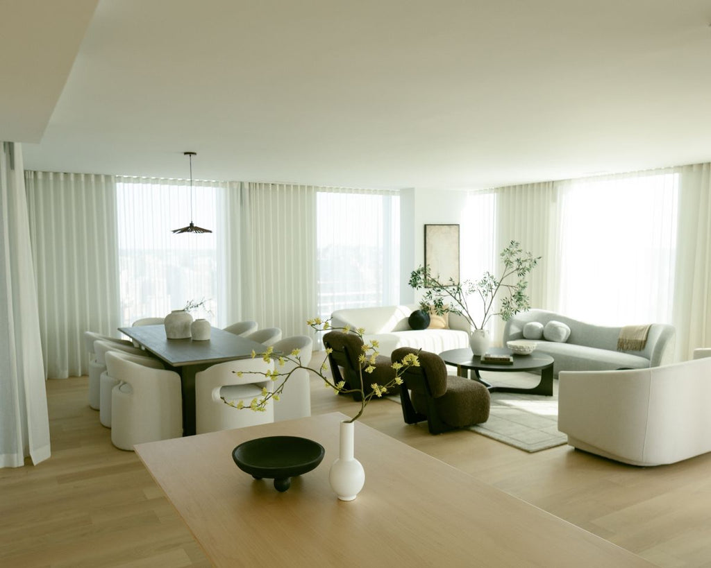 Modern living room with white furniture and large windows