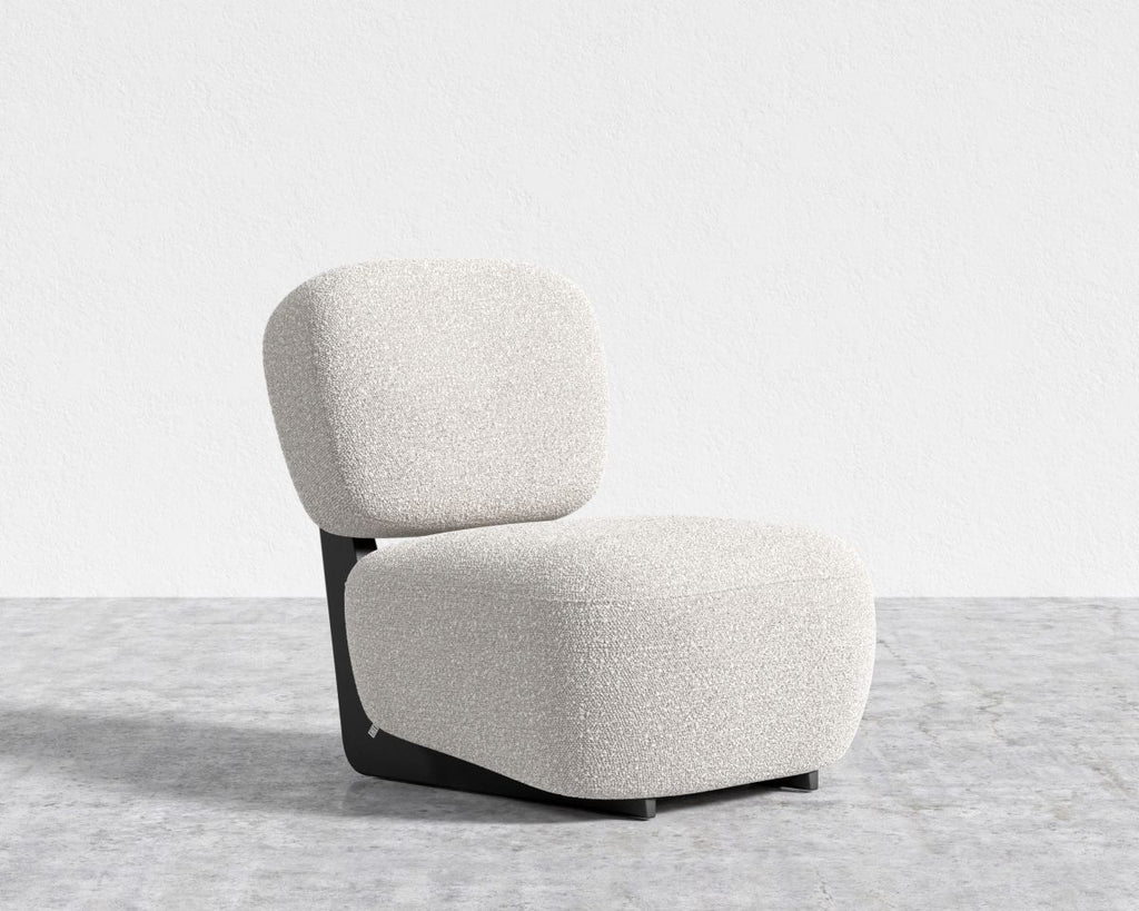 Modern chair with a textured white seat and backrest on a light gray floor.